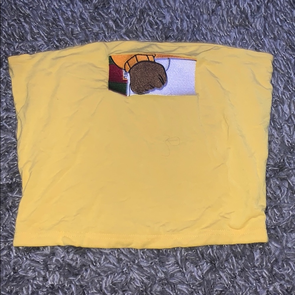 yellow tube top with Arthur’s fist